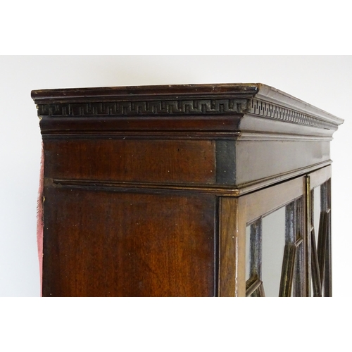 1602 - A Georgian mahogany bureau bookcase, with a moulded top above two astragal glazed doors and a fall f... 