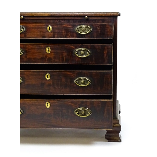 1606 - A George III mahogany bachelors chest of drawers, the moulded top having re-entrant corners above a ... 