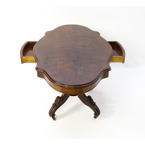 1620 - A 19thC mahogany centre table with a moulded top having two frieze drawers, the pedestal having gadr... 