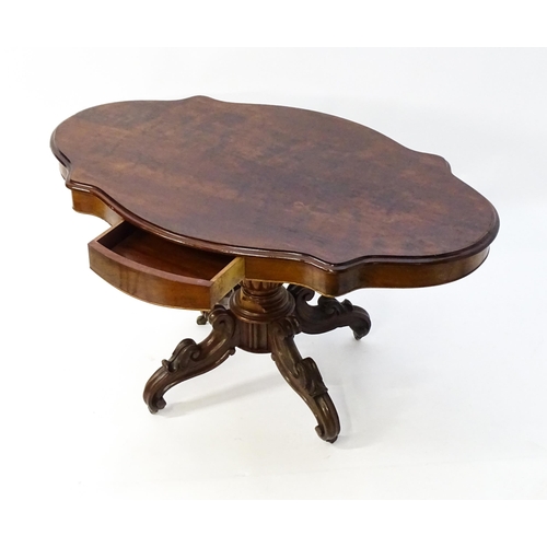 1620 - A 19thC mahogany centre table with a moulded top having two frieze drawers, the pedestal having gadr... 