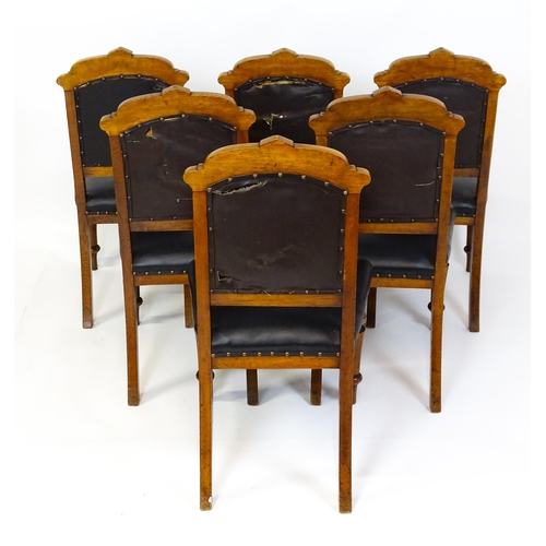 1651 - A set of six late 19thC oak Gothic style dining chairs with floral carved top rails, fluted uprights... 