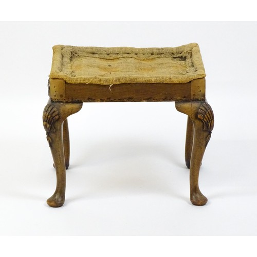 1658 - An early 20thC stool raised on four shell carved cabriole legs terminating in pad feet. 20