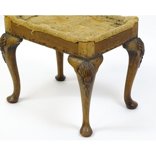 1658 - An early 20thC stool raised on four shell carved cabriole legs terminating in pad feet. 20