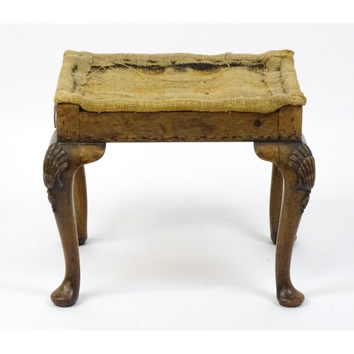 1658 - An early 20thC stool raised on four shell carved cabriole legs terminating in pad feet. 20