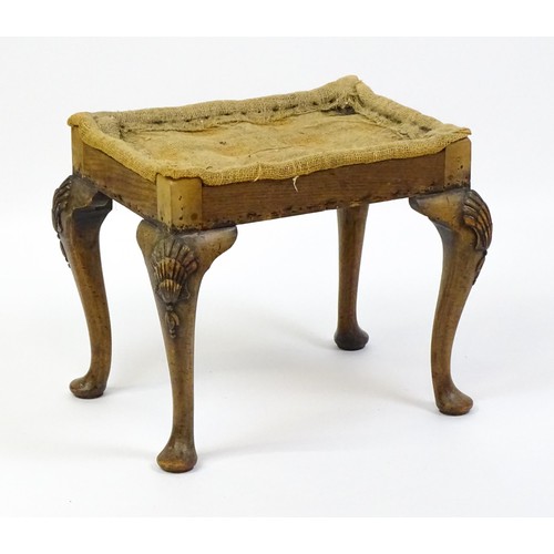 1658 - An early 20thC stool raised on four shell carved cabriole legs terminating in pad feet. 20