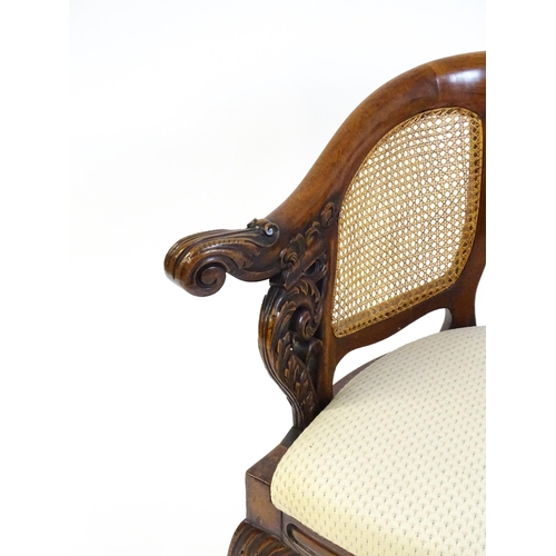 1664 - A mid 19thC mahogany Burgermeister chair, this continental chair having a bowed backrest terminating... 