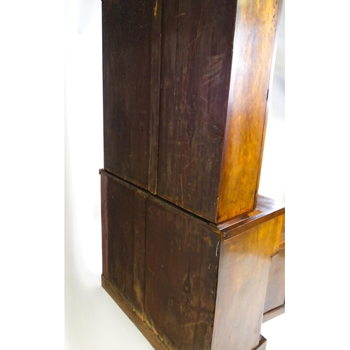 1671 - A 19thC mahogany secretaire bookcase with a moulded top above to glazed doors and three adjustable s... 