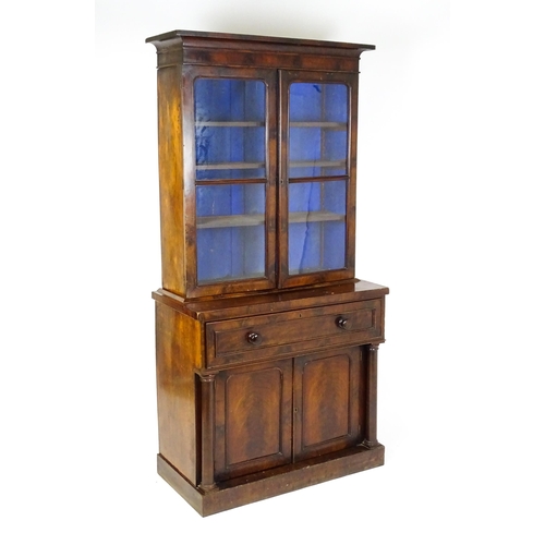 1671 - A 19thC mahogany secretaire bookcase with a moulded top above to glazed doors and three adjustable s... 