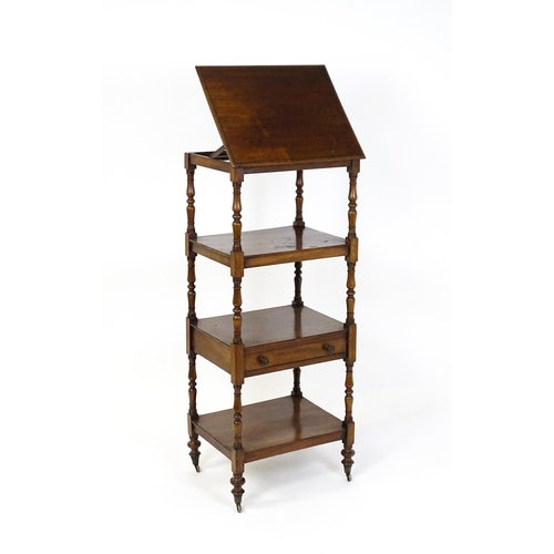 1674 - A 19thC mahogany four tier whatnot with the top tier having an adjustable tilt top, the tiers raised... 