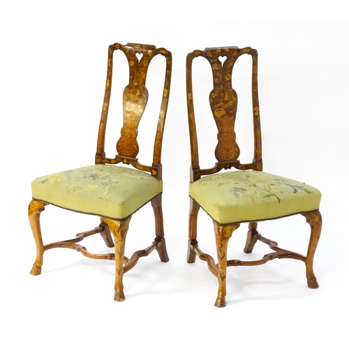 1683 - A pair of early / mid 18thC Dutch side chairs with profusely inlaid walnut frames, the satinwood mar... 