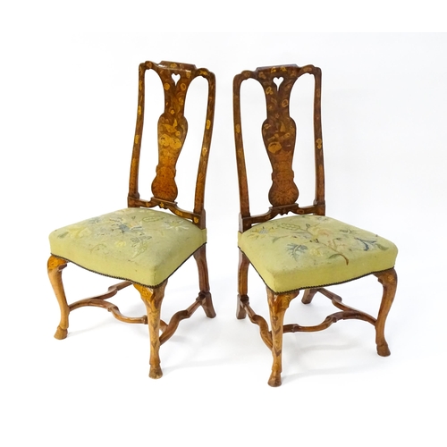 1683 - A pair of early / mid 18thC Dutch side chairs with profusely inlaid walnut frames, the satinwood mar... 