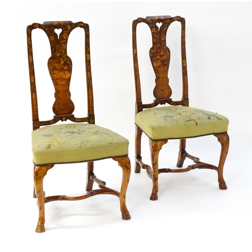 1683 - A pair of early / mid 18thC Dutch side chairs with profusely inlaid walnut frames, the satinwood mar... 