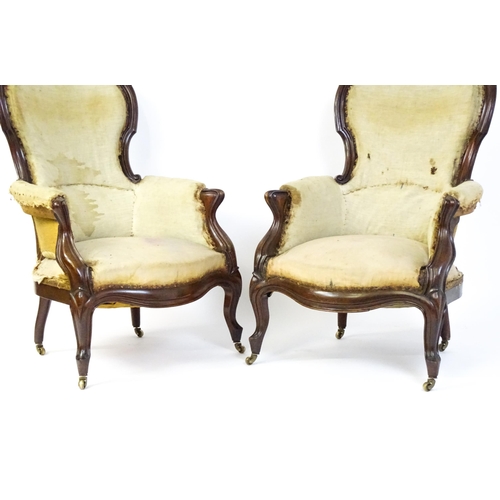 1690 - A pair of 19thC mahogany armchairs for re-upholstery, the chairs having spoon backs, manchettes and ... 