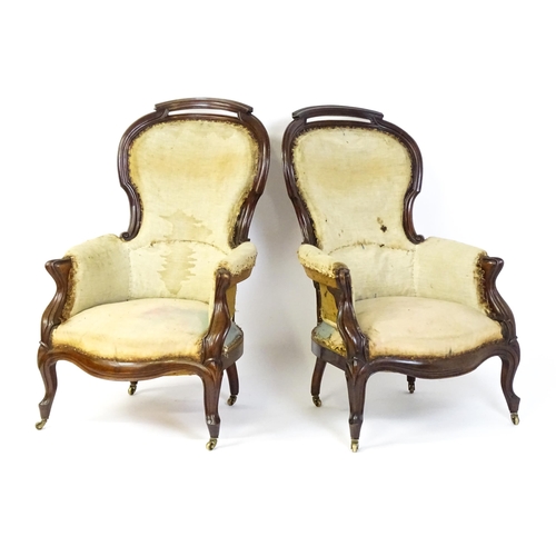 1690 - A pair of 19thC mahogany armchairs for re-upholstery, the chairs having spoon backs, manchettes and ... 