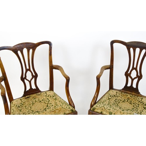 1699 - A pair of late 18thC fruitwood elbow chairs with Chippendale back splats, swept arms, drop in seats ... 