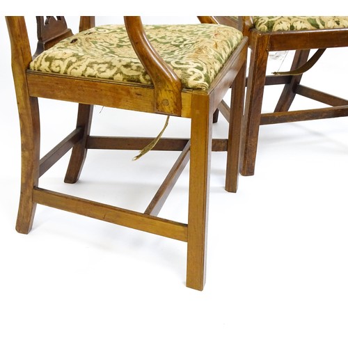 1699 - A pair of late 18thC fruitwood elbow chairs with Chippendale back splats, swept arms, drop in seats ... 