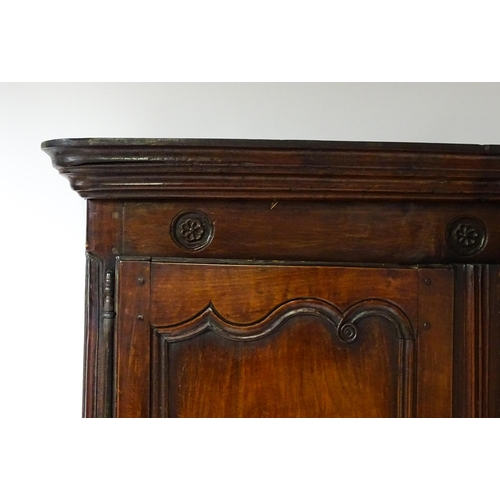 1704 - An 18thC French buffet deux corps with a moulded pediment above a floral carved frieze. The top havi... 