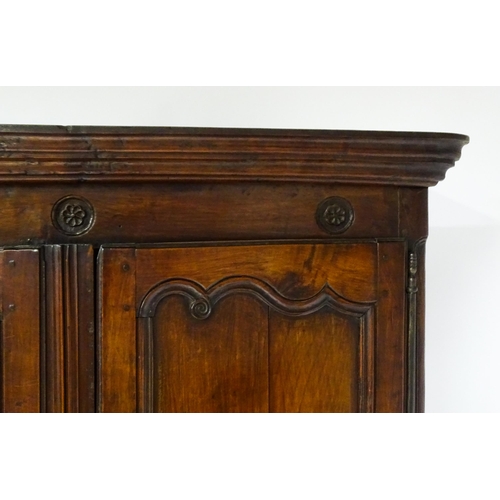 1704 - An 18thC French buffet deux corps with a moulded pediment above a floral carved frieze. The top havi... 