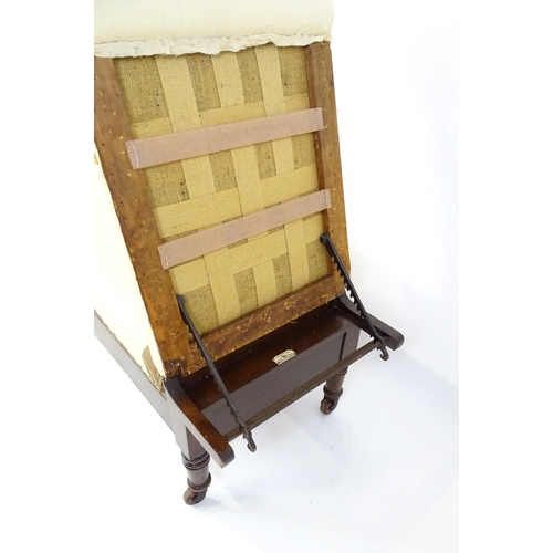 1705 - A Victorian 'Carters Literary Machine' day bed with an adjustable backrest above two short drawers w... 