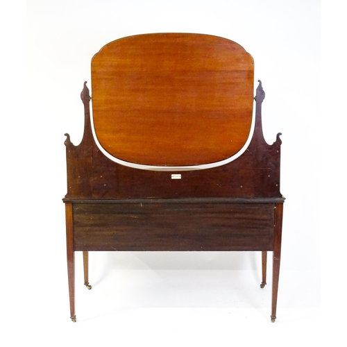 1709 - A late 19thC / early 20thC mahogany Maple & Co dressing table with a decoratively strung mirror abov... 