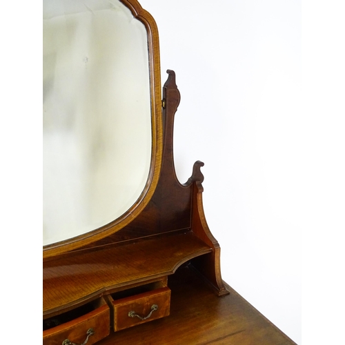 1709 - A late 19thC / early 20thC mahogany Maple & Co dressing table with a decoratively strung mirror abov... 