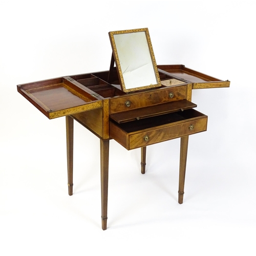 1714 - A late Georgian mahogany dressing table / vanity table with a double hinged top opening to show an i... 