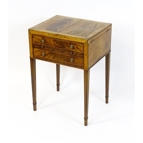 1714 - A late Georgian mahogany dressing table / vanity table with a double hinged top opening to show an i... 