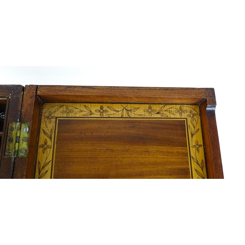 1714 - A late Georgian mahogany dressing table / vanity table with a double hinged top opening to show an i... 