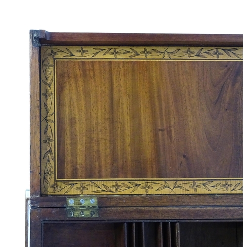 1714 - A late Georgian mahogany dressing table / vanity table with a double hinged top opening to show an i... 