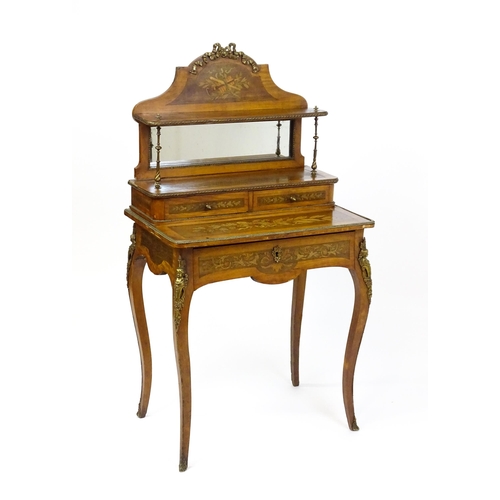 1715 - A 19thC mahogany Bonheur du jour with a shaped and mirrored upstand having marquetry decoration matc... 