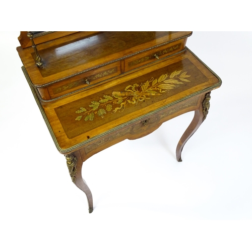 1715 - A 19thC mahogany Bonheur du jour with a shaped and mirrored upstand having marquetry decoration matc... 