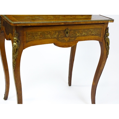 1715 - A 19thC mahogany Bonheur du jour with a shaped and mirrored upstand having marquetry decoration matc... 