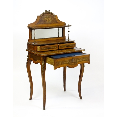 1715 - A 19thC mahogany Bonheur du jour with a shaped and mirrored upstand having marquetry decoration matc... 