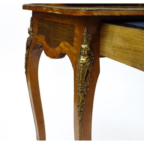 1715 - A 19thC mahogany Bonheur du jour with a shaped and mirrored upstand having marquetry decoration matc... 