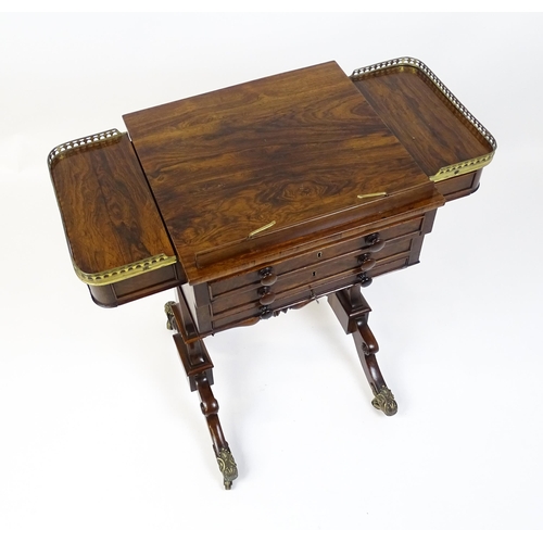 1562 - A Regency rosewood work / games table with a brass gallery above two short drawers. The top having a... 