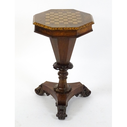 1563 - A Victorian walnut trumpet shaped work table / sewing table with an inlaid octagonal top raised on t... 