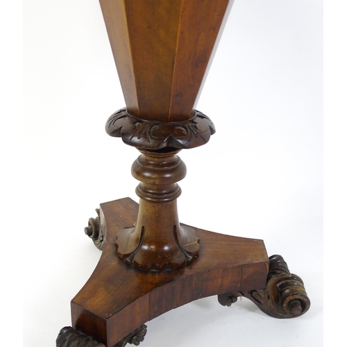 1563 - A Victorian walnut trumpet shaped work table / sewing table with an inlaid octagonal top raised on t... 