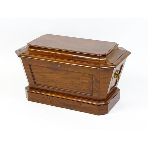 1568 - An early 19thC mahogany wine cooler of sarcophagus form with a moulded hinged lid above a panelled f... 