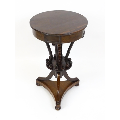 1570 - An early / mid 19thC unusual table with a laburnum top having four short drawers above five rope tur... 