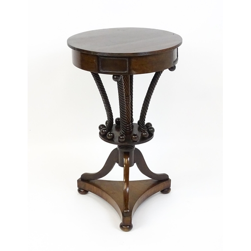 1570 - An early / mid 19thC unusual table with a laburnum top having four short drawers above five rope tur... 