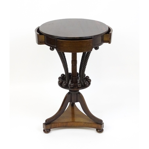 1570 - An early / mid 19thC unusual table with a laburnum top having four short drawers above five rope tur... 