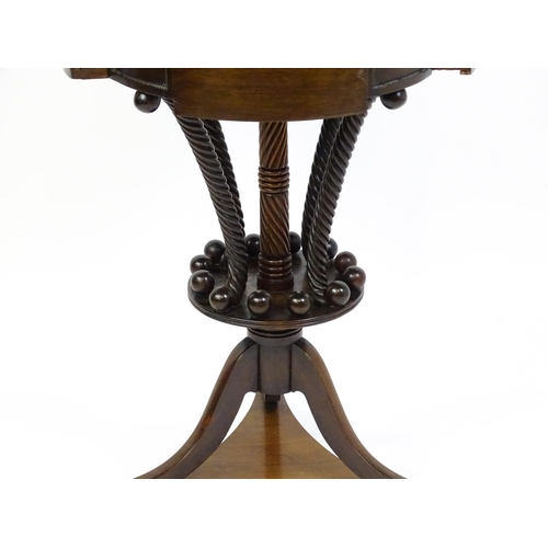 1570 - An early / mid 19thC unusual table with a laburnum top having four short drawers above five rope tur... 