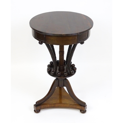 1570 - An early / mid 19thC unusual table with a laburnum top having four short drawers above five rope tur... 