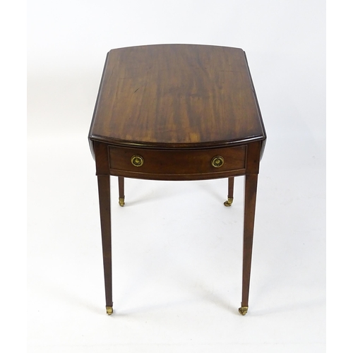 1595 - An early 19thC mahogany Pembroke table with two demi lune leaves flanking a single short drawer to o... 