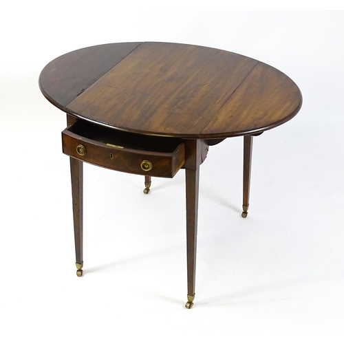 1595 - An early 19thC mahogany Pembroke table with two demi lune leaves flanking a single short drawer to o... 