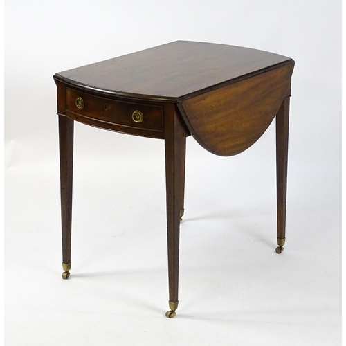 1595 - An early 19thC mahogany Pembroke table with two demi lune leaves flanking a single short drawer to o... 