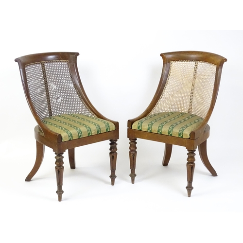 1598 - A pair of 19thC mahogany Gillows style bergère chairs with caned and bowed backrests above drop in s... 