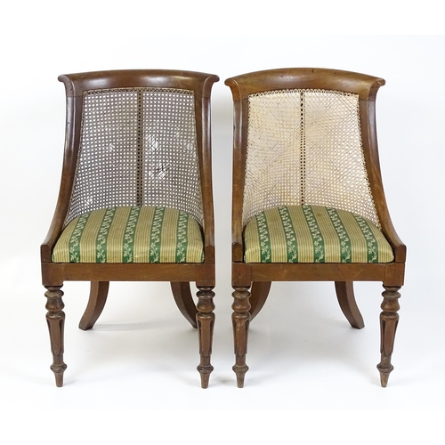 1598 - A pair of 19thC mahogany Gillows style bergère chairs with caned and bowed backrests above drop in s... 