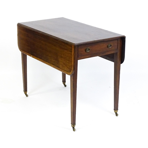 1601 - A 19thC mahogany Pembroke table with a crossbanded top and inlaid decoration above a single frieze d... 