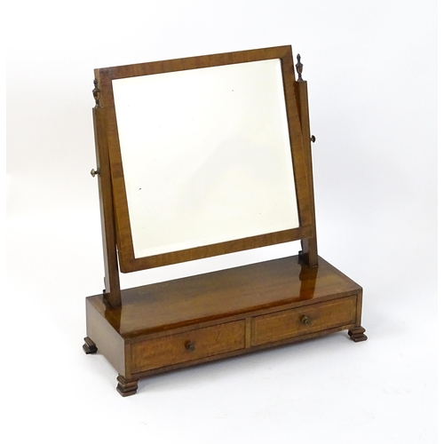 1604 - A late 19thC / early 20thC mahogany and satinwood crossbanded mirror having a square glass flanked b... 